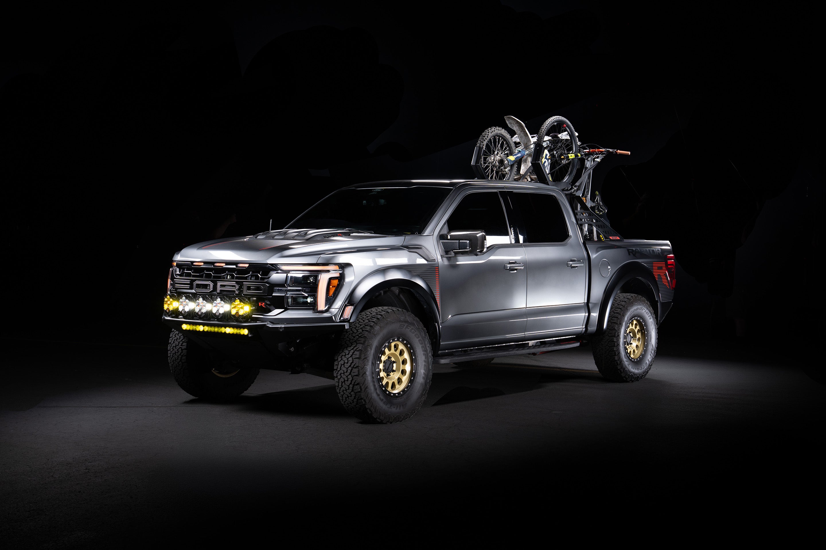 A Ford Raptor R with a Truck Bed Rack for mountain bikes dirt bikes skis snowboards, a chase rack for Ford Raptor