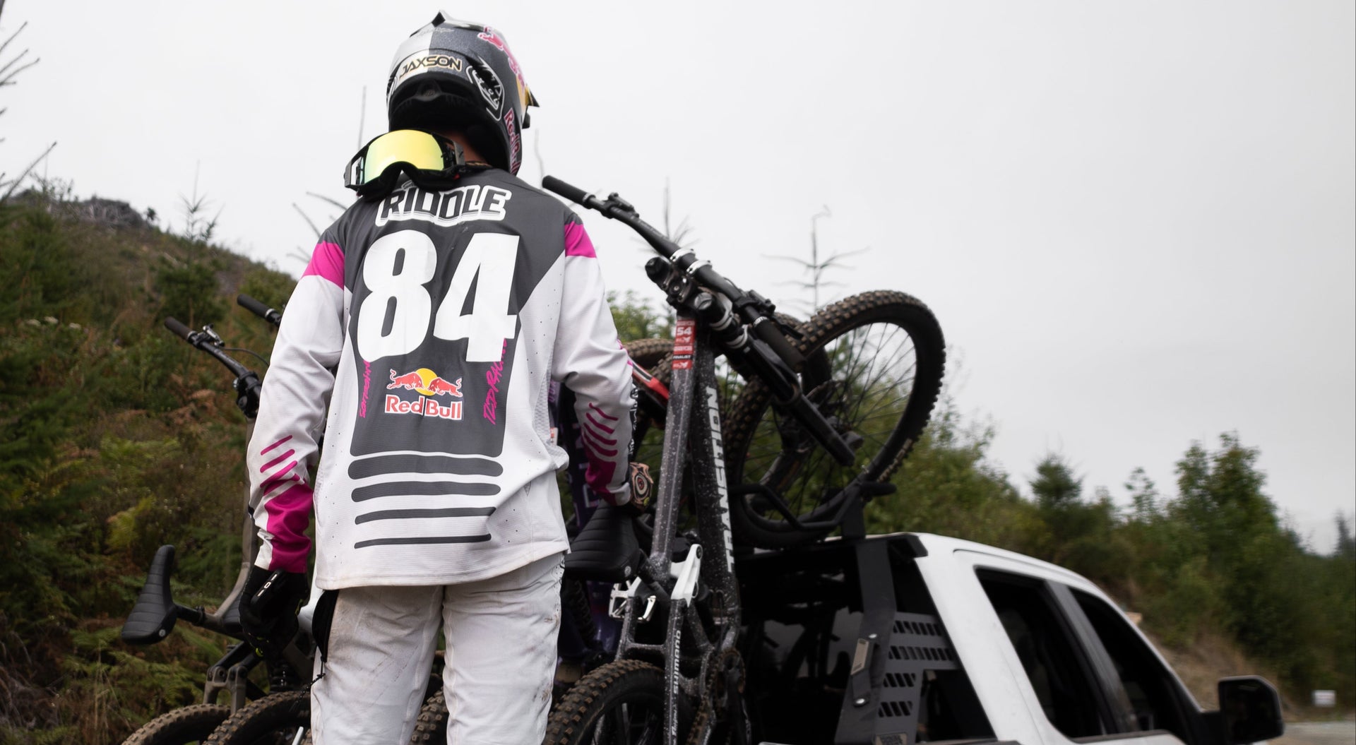 Jaxson Riddle with bikes in the bed of a truck with his bike rack setup