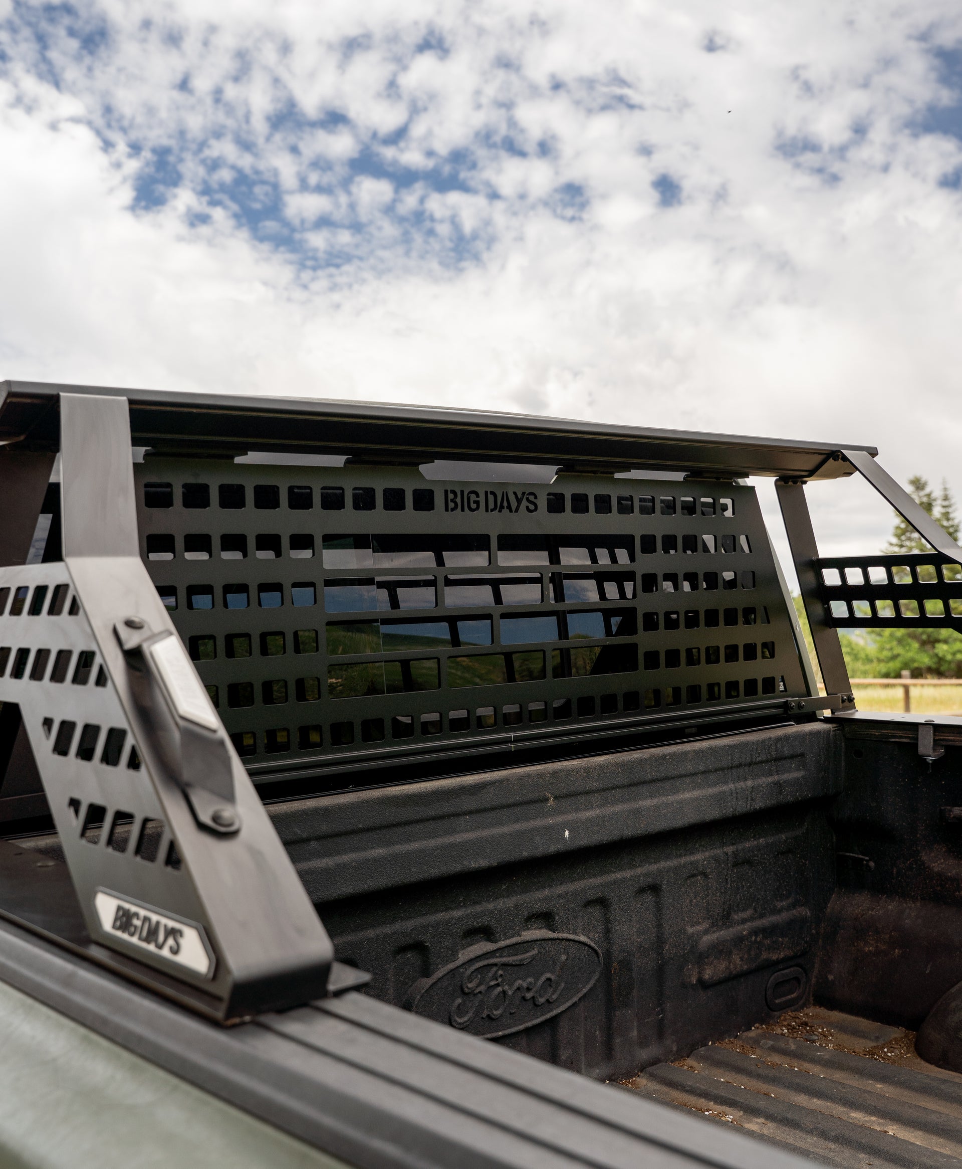 A pickup truck with a Chase rack and headache rack with molle panel for mounting attachments like fuel cans, high lift jacks and more